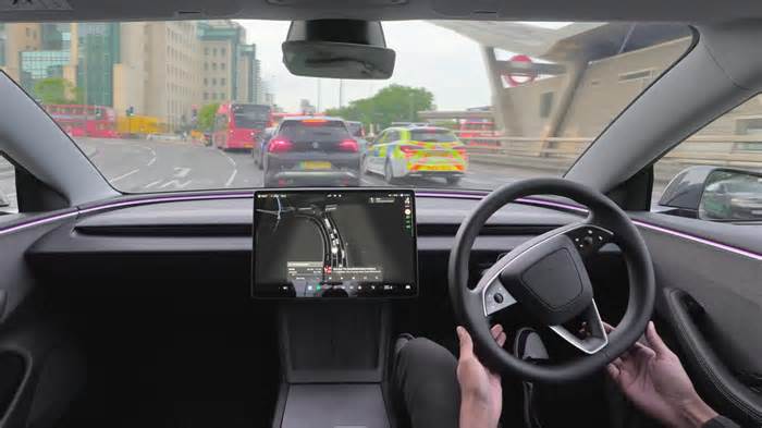 A Tesla Model 3 has driven itself around a 'Magic Roundabout' in the UK