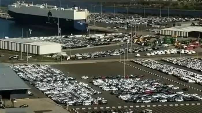 Real story behind huge Tesla ‘car GRAVEYARD’ as shocking images show sea of new EVs left abandoned & gathering dust