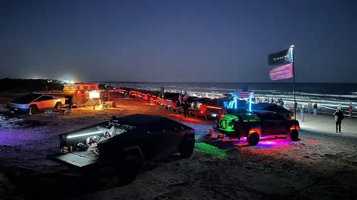 Watch: Tesla Cybertrucks perform Starbase light show with SpaceX's mega-rocket as the background