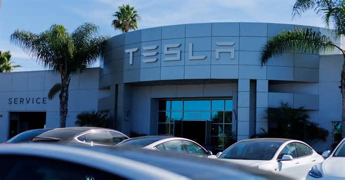 Tesla posts first fall in annual deliveries as demand slows