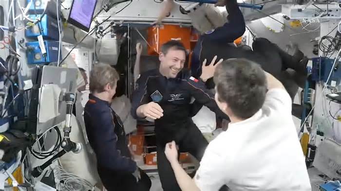 Crew docks at space station for 2-week commercial mission