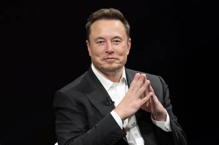 Elon Musk's Lawyers Say He Doesn't 'Use A Computer,' But The Tesla CEO Has Touted An 'Ancient PC Laptop' With A Dogecoin Sticker More Than Once