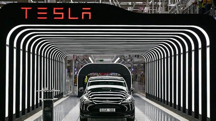 Tesla profit tumbles as Musk’s political focus clouds company outlook