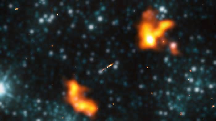 Massive jets of material shooting from a black hole dwarf even the largest galaxies, scientists say