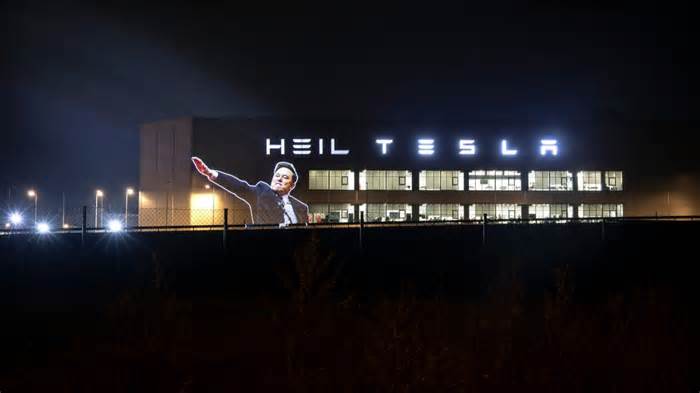 UK group projects ‘Heil Tesla’ and Elon Musk’s hand gesture onto German factory