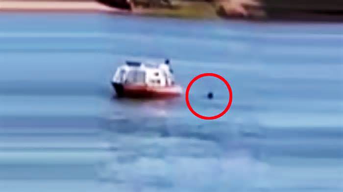 Moment ‘prophet’ who believes Elon Musk is Jesus Christ is rescued from piranha-infested river while on ‘divine mission’