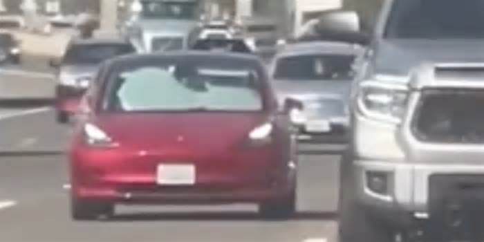 Tesla Model 3 Spotted Driving Down Highway with Windshield, Windows Covered