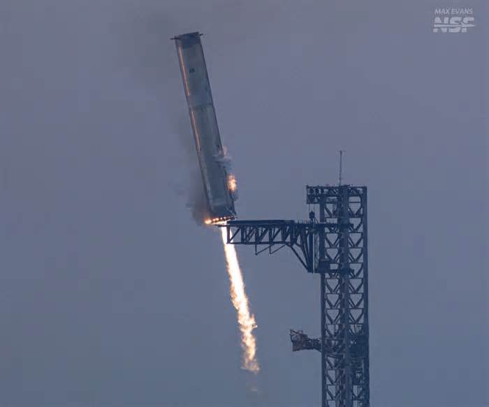 SpaceX Catches a Super Heavy Booster During a...