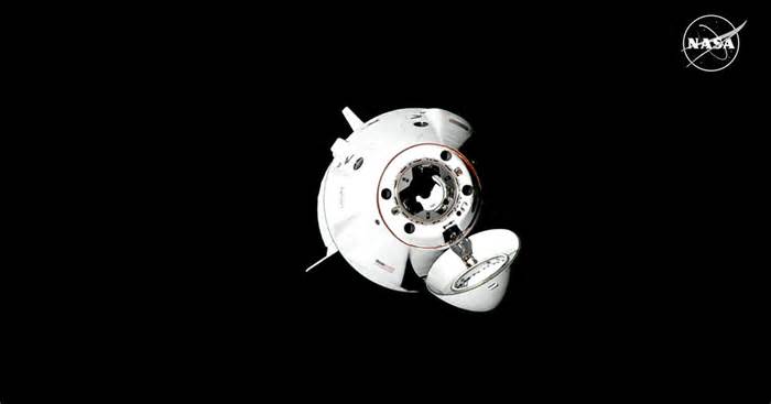 Crew Dragon brings two-man crew to space station amid probe of upper stage anomaly