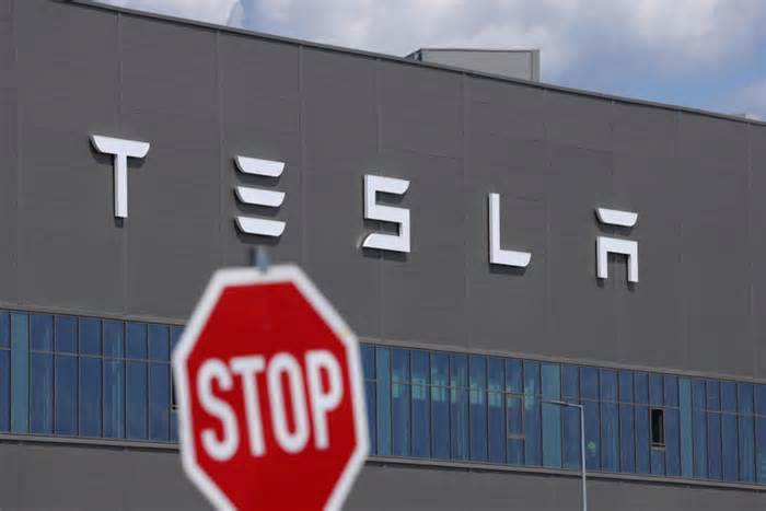 Tesla earnings show plunging revenue as Elon Musk's EV maker warns of hits from Trump's tariffs