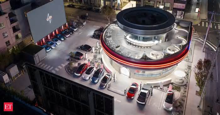 Elon Musk’s Tesla diner has robots serving popcorn, cybertruck food boxes and 66ft movie screens. Check full list of menu