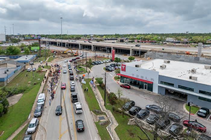 Tesla vehicles repeatedly circle an Austin block as robotaxi launch looms