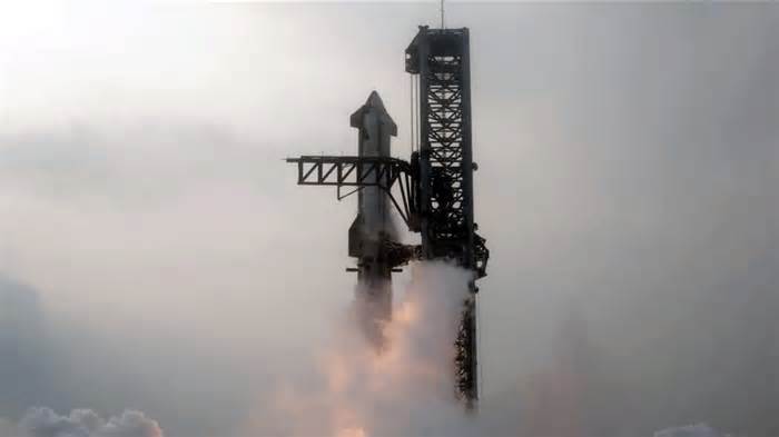 SpaceX catches rocket booster in historic Starship test flight: 'Science fiction come true'