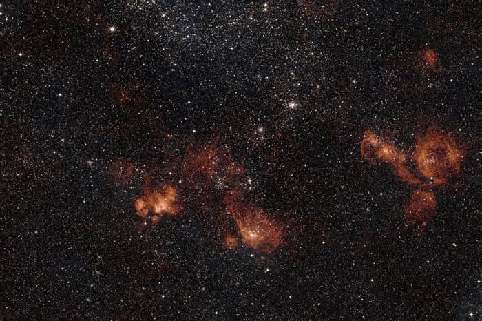 NASA astronaut shares surreal photo of Earth, 3 galaxies